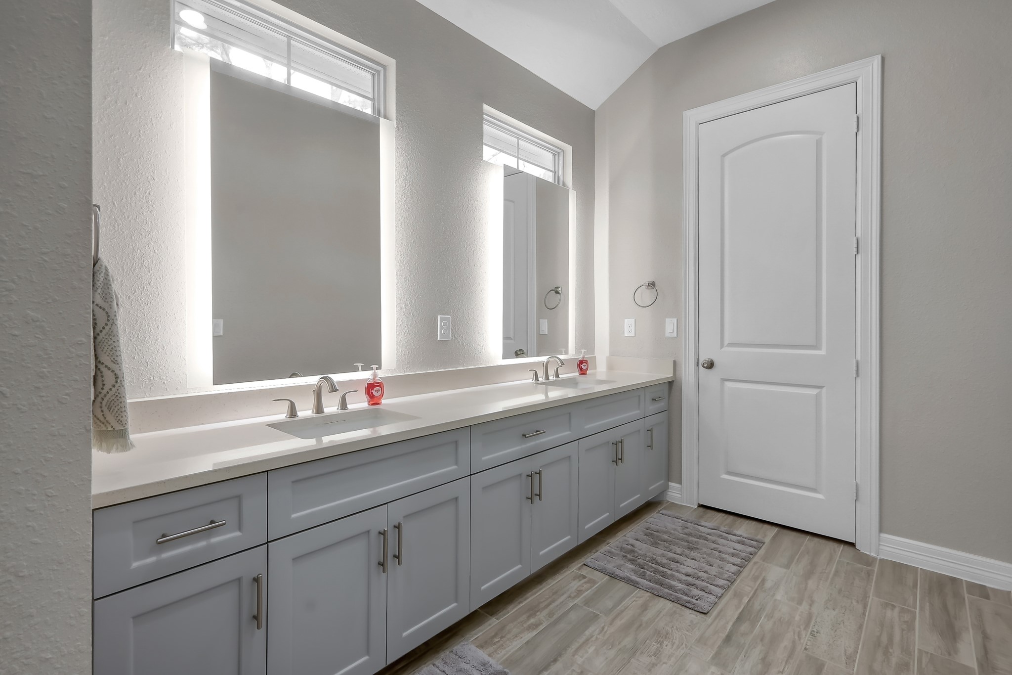 14609 Jim Stowe Road Conroe, TX 77302 - Photo 12 of 24 a bathroom with a double vanity sink and a mirror