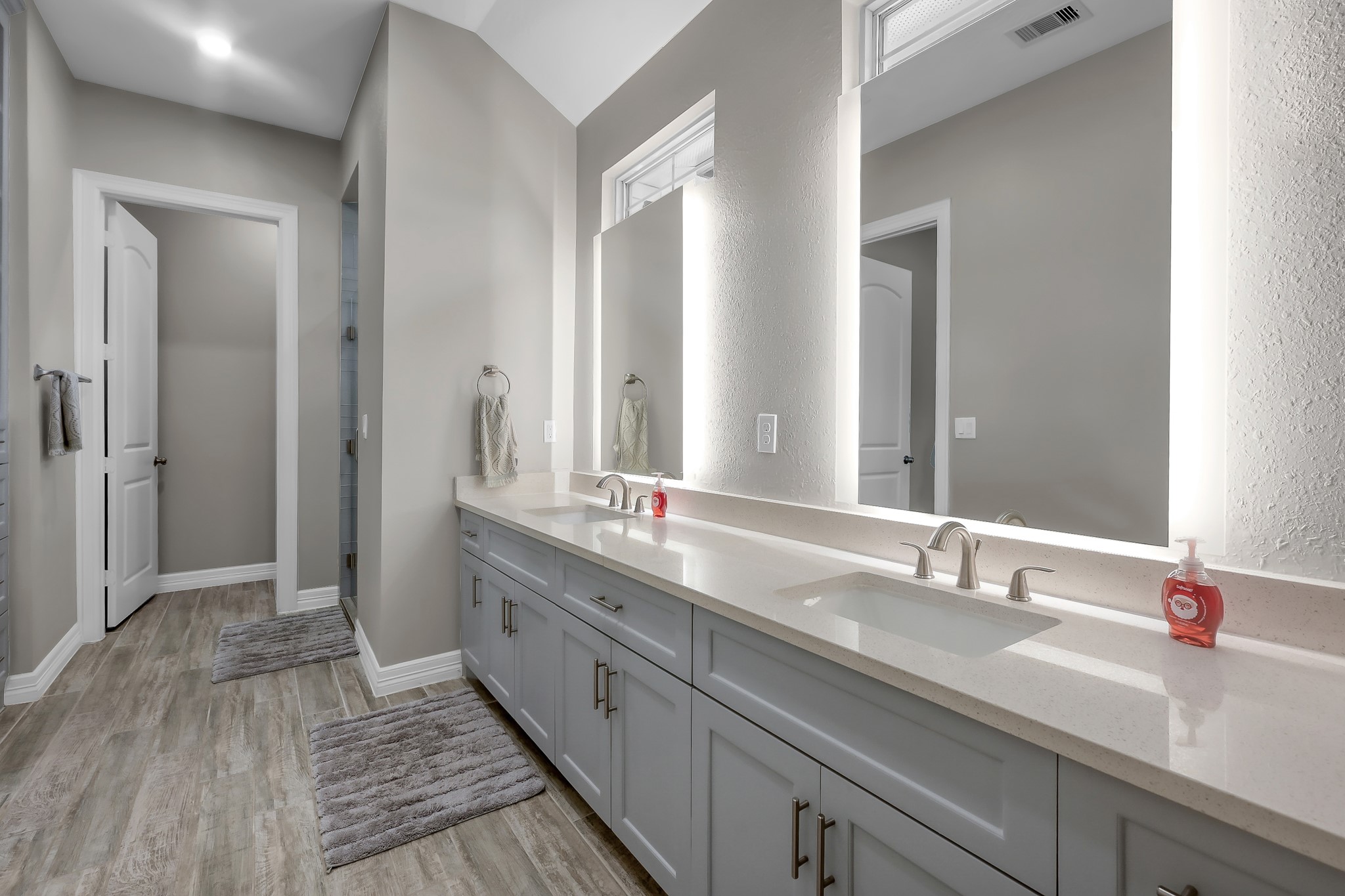 14609 Jim Stowe Road Conroe, TX 77302 - Photo 13 of 24 a bathroom with double vanity sinks and a mirror