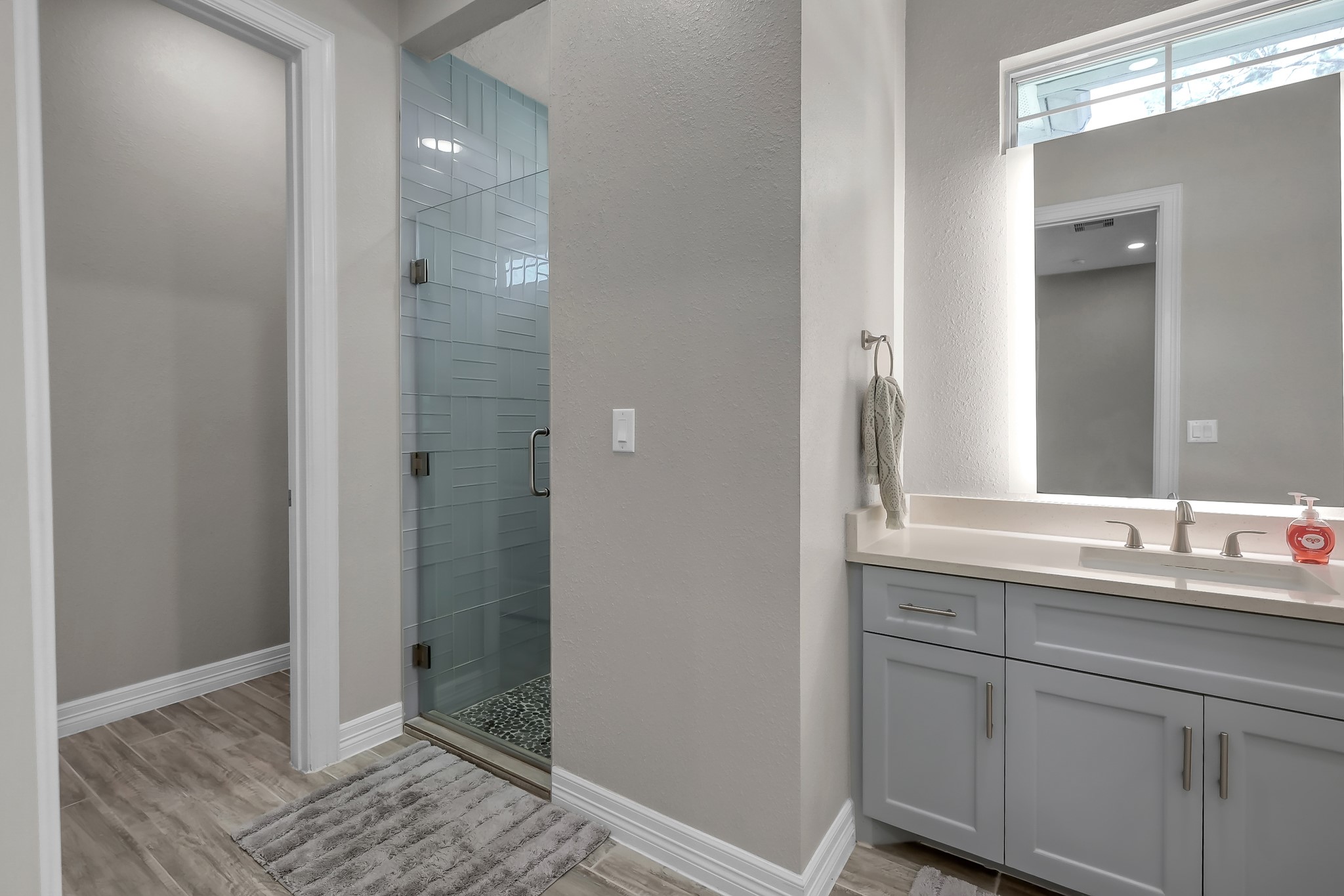 14609 Jim Stowe Road Conroe, TX 77302 - Photo 14 of 24 a bathroom with a sink and a mirror