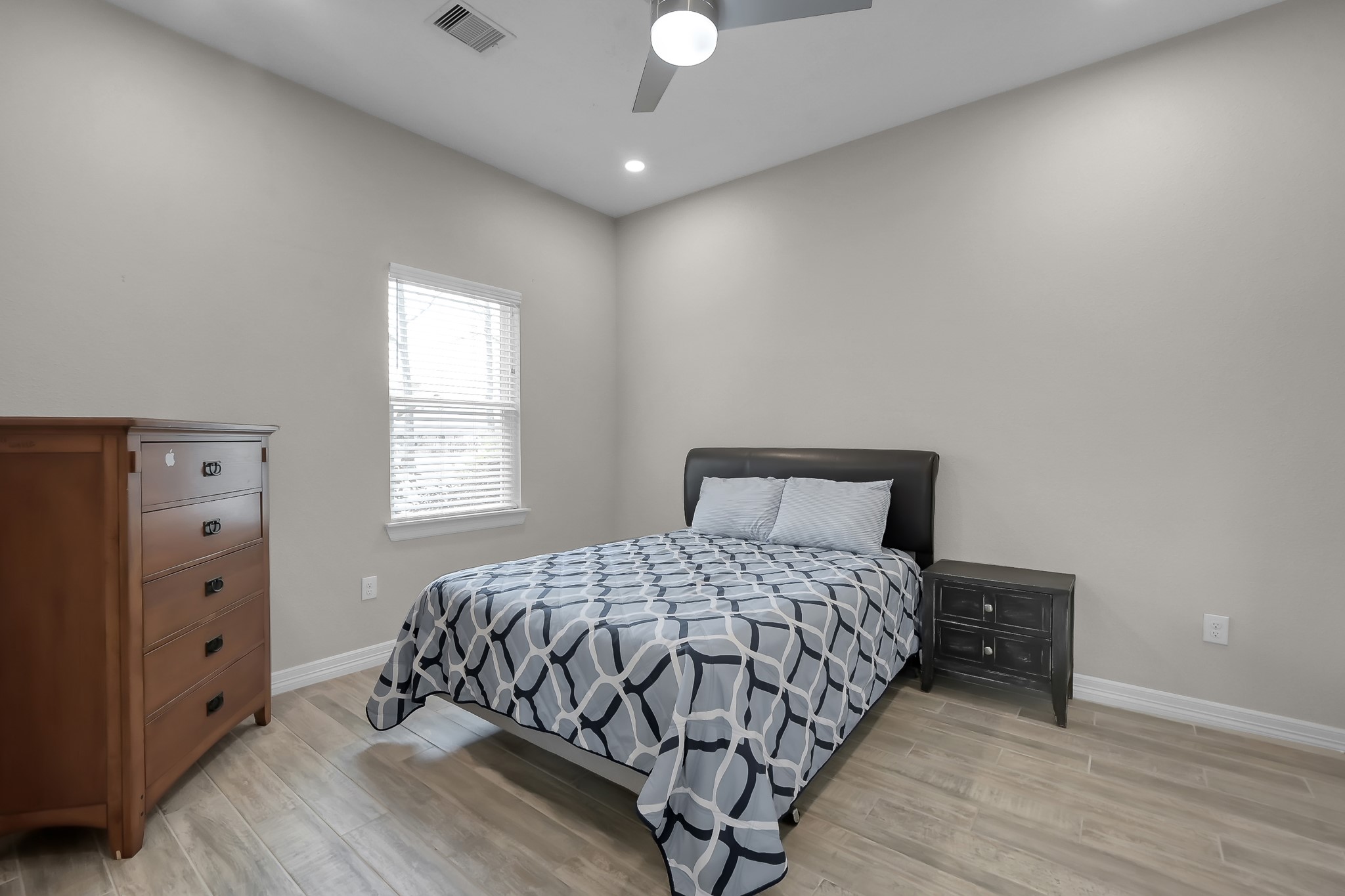 14609 Jim Stowe Road Conroe, TX 77302 - Photo 15 of 24 a bedroom with a bed and a window