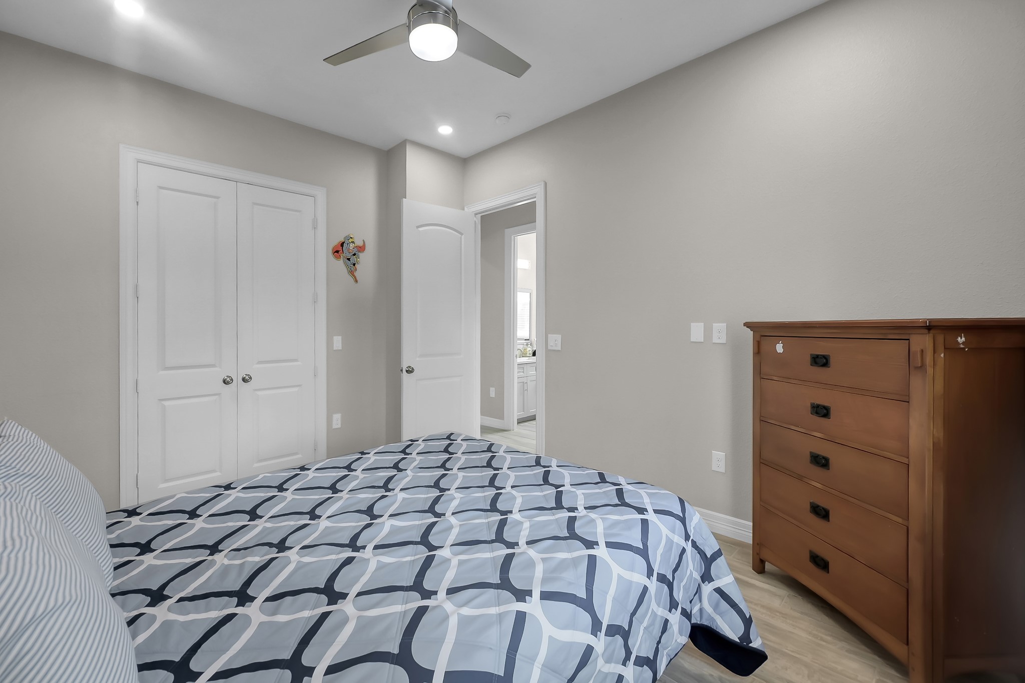 14609 Jim Stowe Road Conroe, TX 77302 - Photo 16 of 24 a bedroom with a bed and a dresser