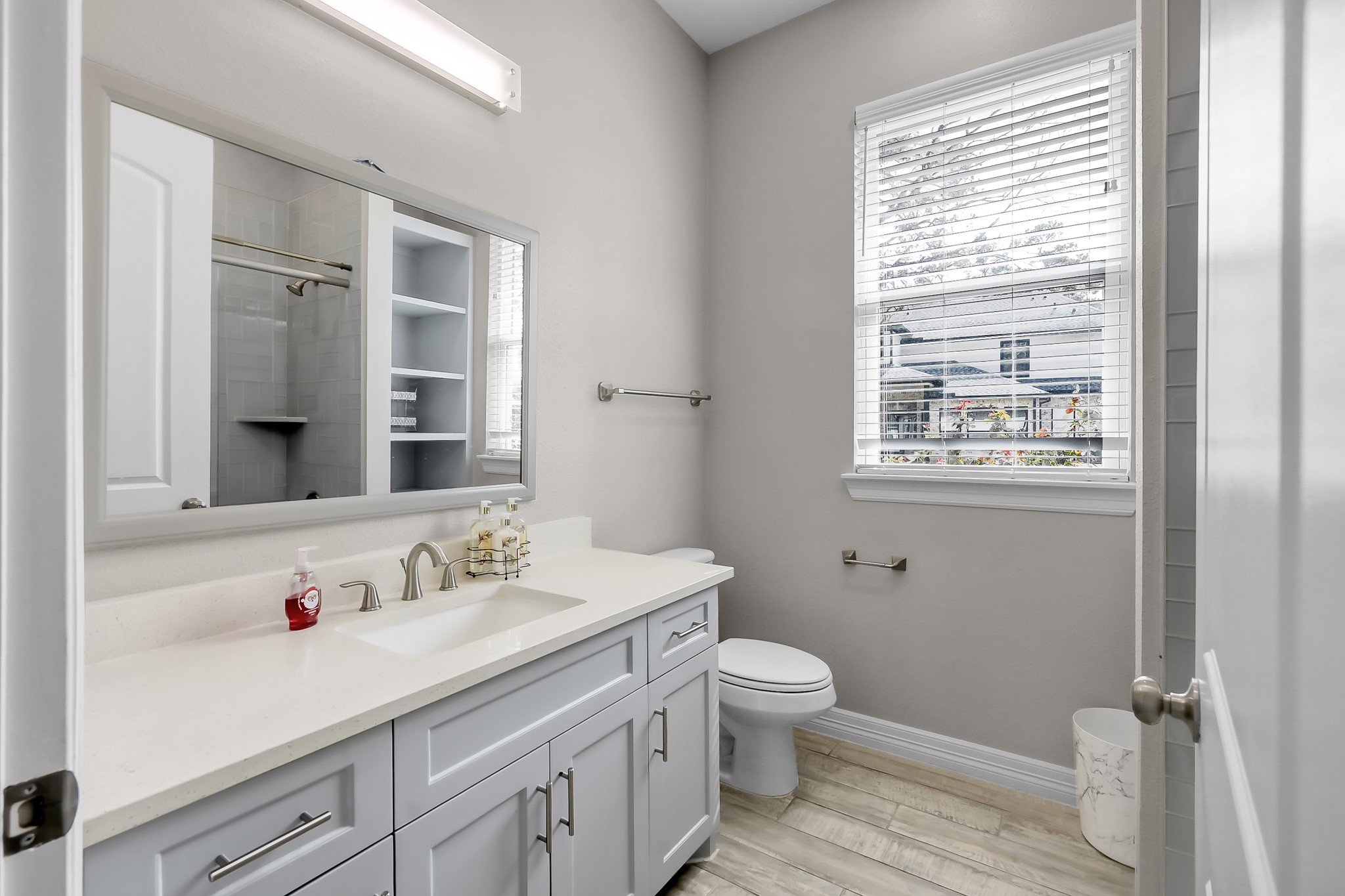 14609 Jim Stowe Road Conroe, TX 77302 - Photo 17 of 24 a bathroom with a sink a toilet and shower