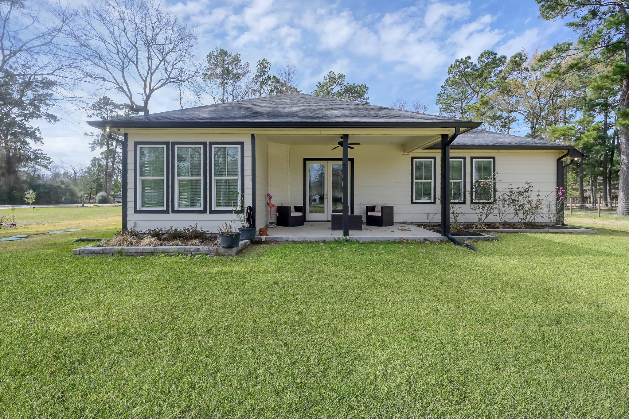 14609 Jim Stowe Road Conroe, TX 77302 - Photo 23 of 24 front view of a house with a garden