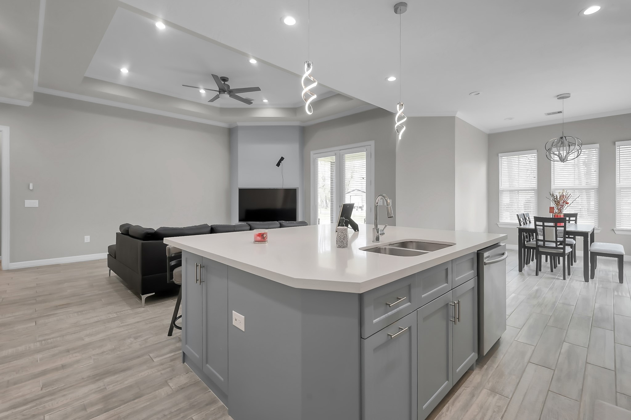 14609 Jim Stowe Road Conroe, TX 77302 - Photo 8 of 24 a kitchen with a sink and chairs