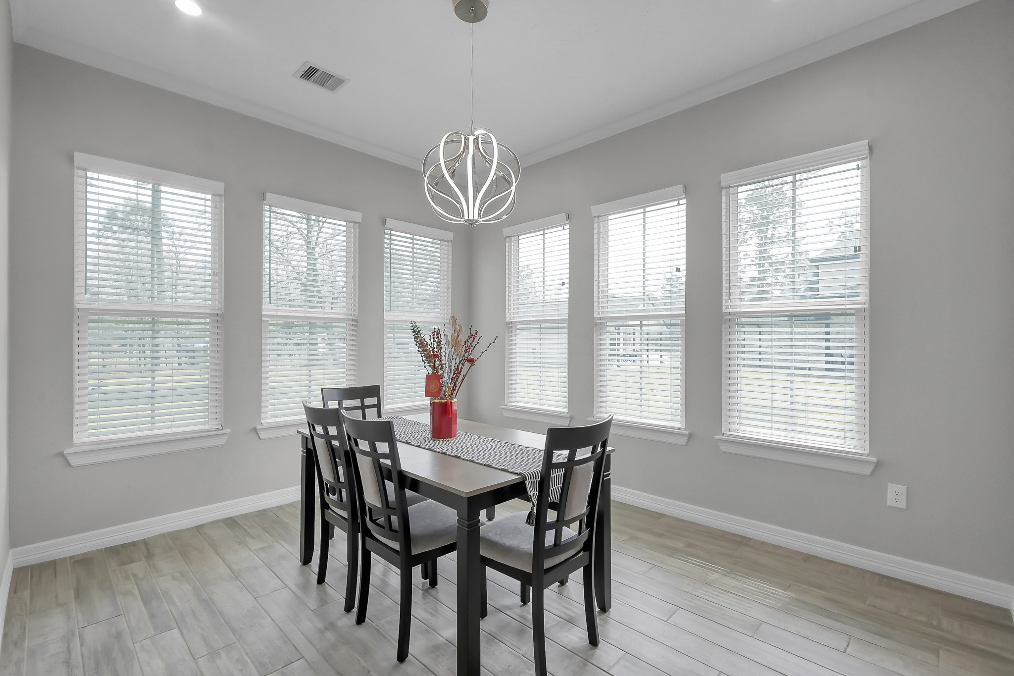 14609 Jim Stowe Road Conroe, TX 77302 - Photo 9 of 24 a view of a dining room with furniture window and wooden floor