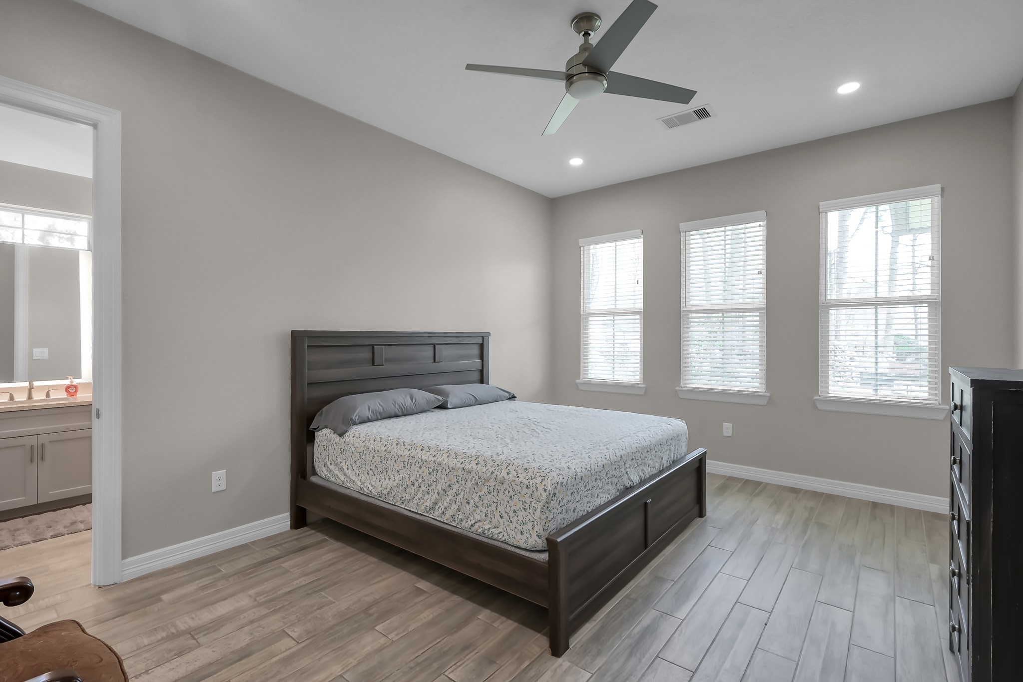 14609 Jim Stowe Road Conroe, TX 77302 - Photo 10 of 24 a bedroom with a bed and window