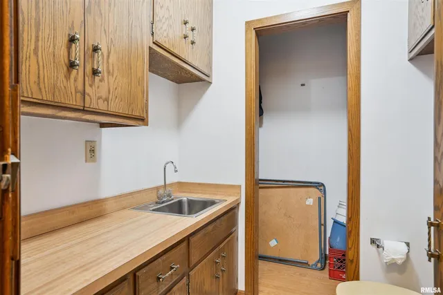 a kitchen with a sink and cabinets