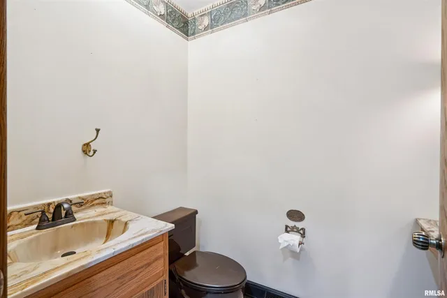 a bathroom with a sink and toilet