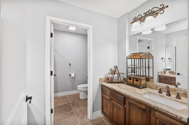 a bedroom with a bed dresser and a window