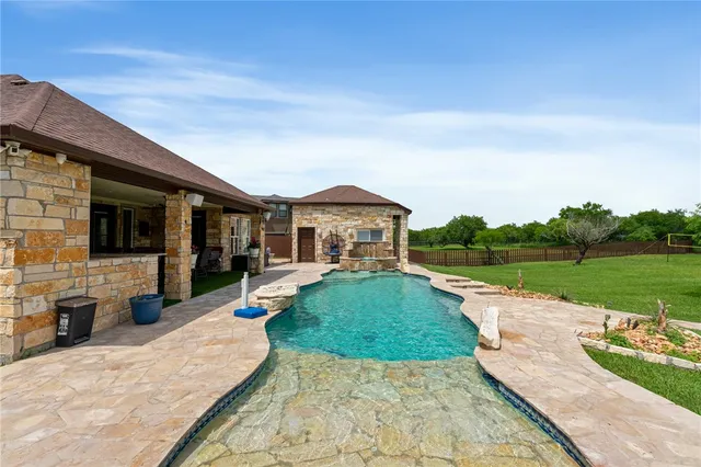 a view of a park with large trees