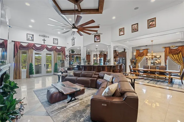 a living room with fireplace furniture and a flat screen tv
