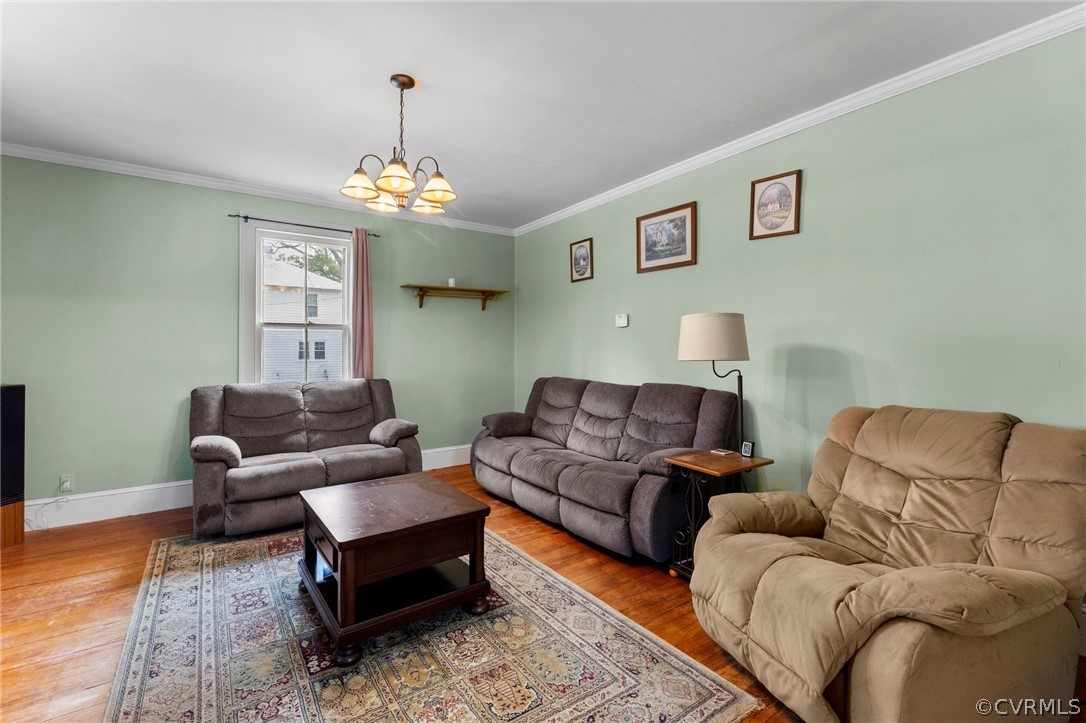 29404 Carson Road Carson, VA 23830 - Photo 7 of 40 a living room with furniture a chandelier and a couch