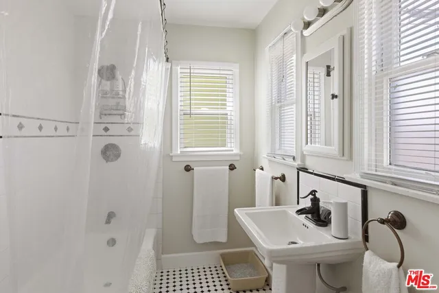 a bathroom with a sink and a window