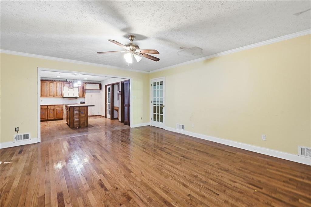 1453 Clearview Drive Northwest Acworth, GA 30102 - Photo 12 of 50 a view of empty room with wooden floor and fan
