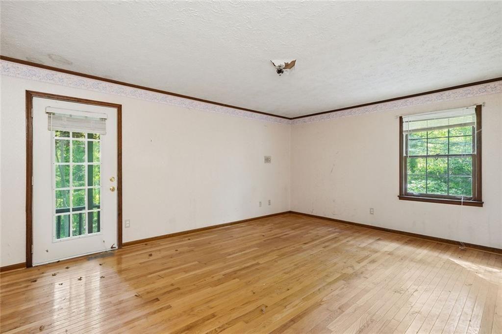 1453 Clearview Drive Northwest Acworth, GA 30102 - Photo 14 of 50 wooden floor in an empty room with a window