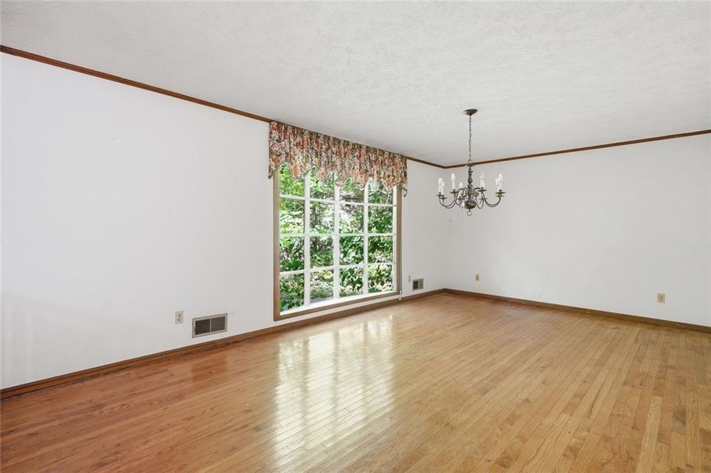 1453 Clearview Drive Northwest Acworth, GA 30102 - Photo 15 of 50 a view of an empty room with wooden floor and a window