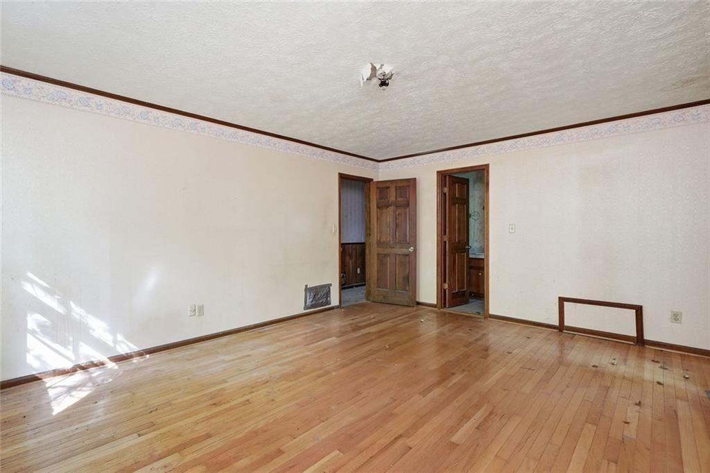 1453 Clearview Drive Northwest Acworth, GA 30102 - Photo 17 of 50 a view of empty room with wooden floor