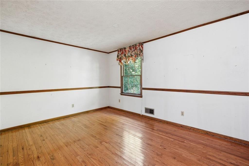 1453 Clearview Drive Northwest Acworth, GA 30102 - Photo 19 of 50 a view of an empty room with wooden floor