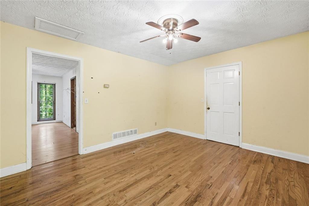 1453 Clearview Drive Northwest Acworth, GA 30102 - Photo 22 of 50 an empty room with wooden floor and windows