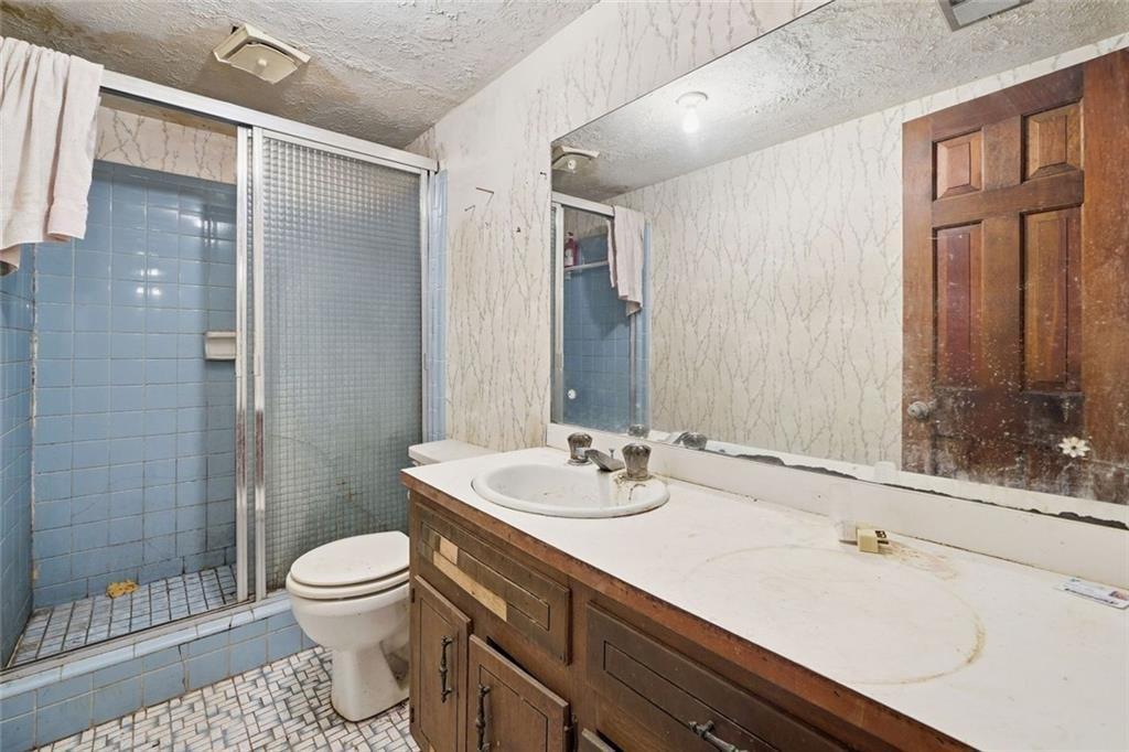 1453 Clearview Drive Northwest Acworth, GA 30102 - Photo 24 of 50 a bathroom with a sink toilet and shower