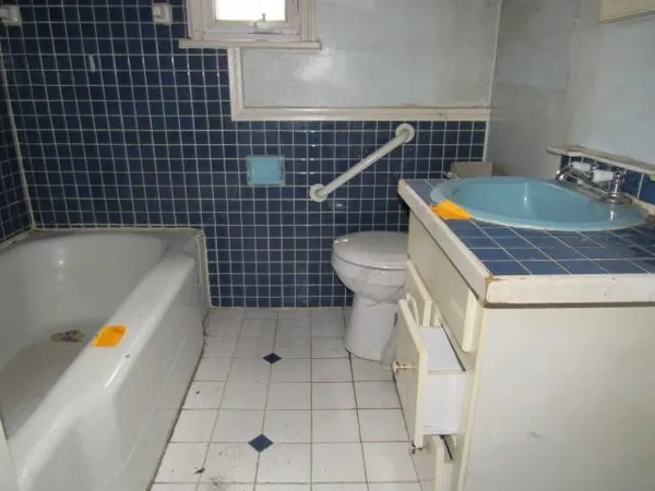 a bathroom with a sink a toilet and bathtub
