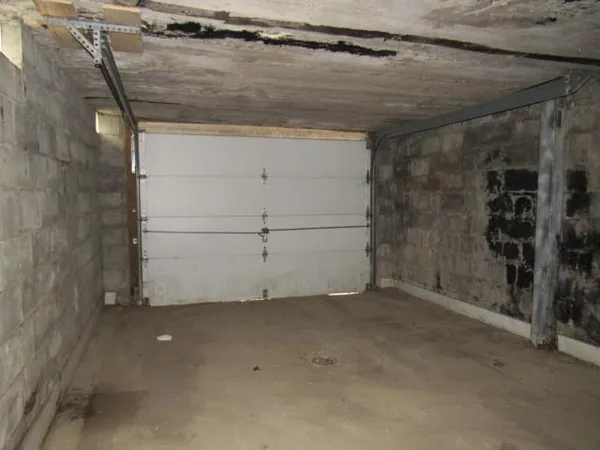 a kitchen with a sink and refrigerator