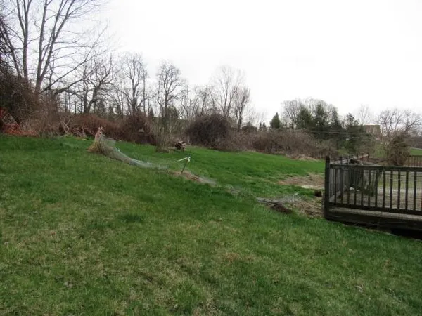 a view of a deck with a yard