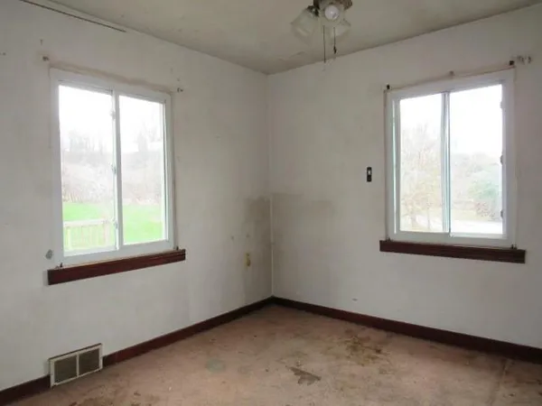 a view of a room that has a window in it