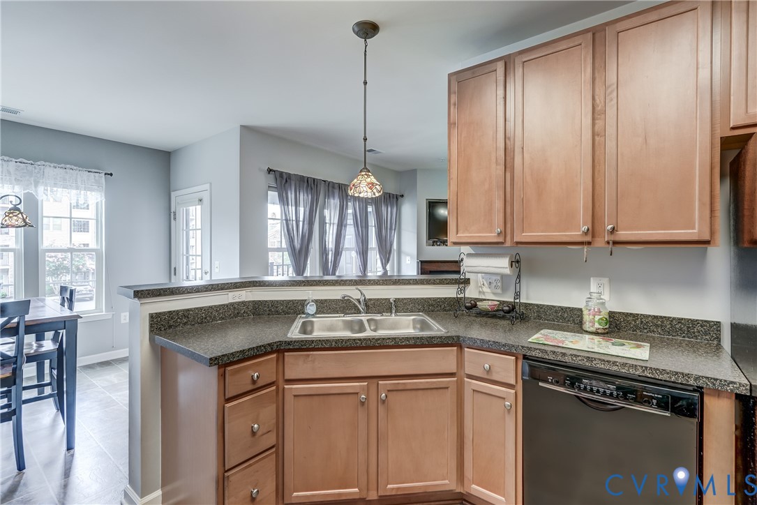 14010 Briars Circle, Unit 204 Midlothian, VA 23114 - Photo 11 of 40 a kitchen with stainless steel appliances granite countertop a sink a stove and a granite counter tops