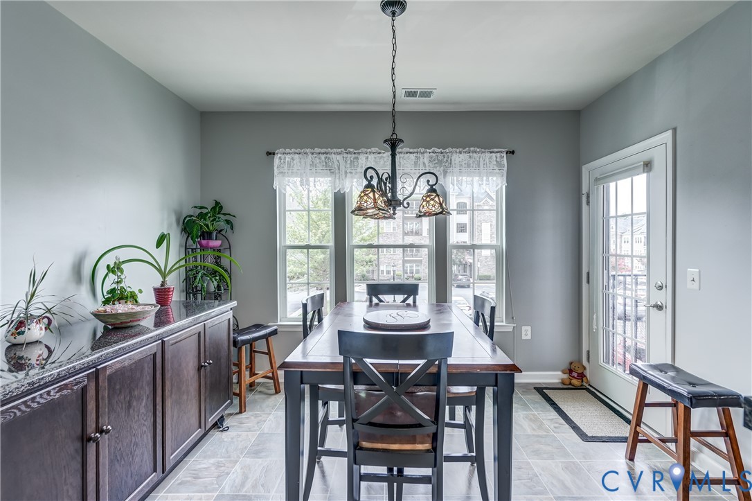 14010 Briars Circle, Unit 204 Midlothian, VA 23114 - Photo 15 of 40 a view of a dining room with furniture window and outside view