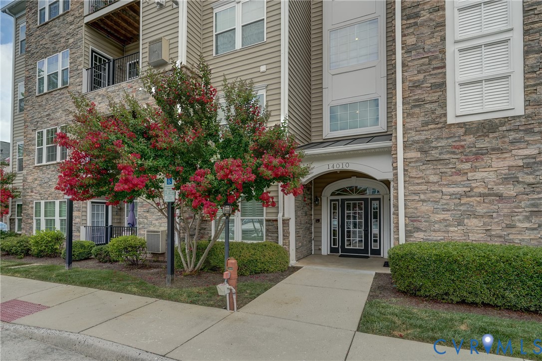 14010 Briars Circle, Unit 204 Midlothian, VA 23114 - Photo 2 of 40 a front view of a house with a garden