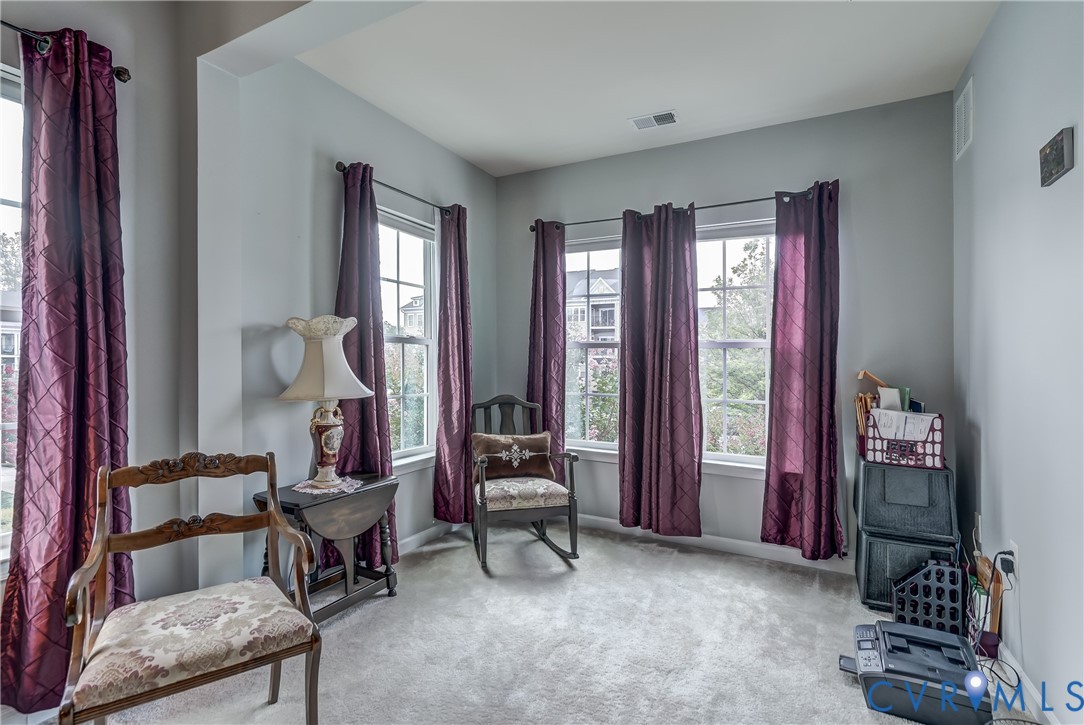 14010 Briars Circle, Unit 204 Midlothian, VA 23114 - Photo 21 of 40 a living room with furniture and a window