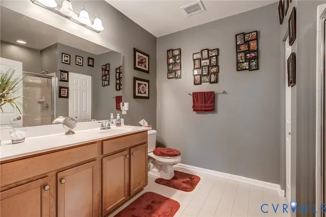 a bathroom with a glass shower door