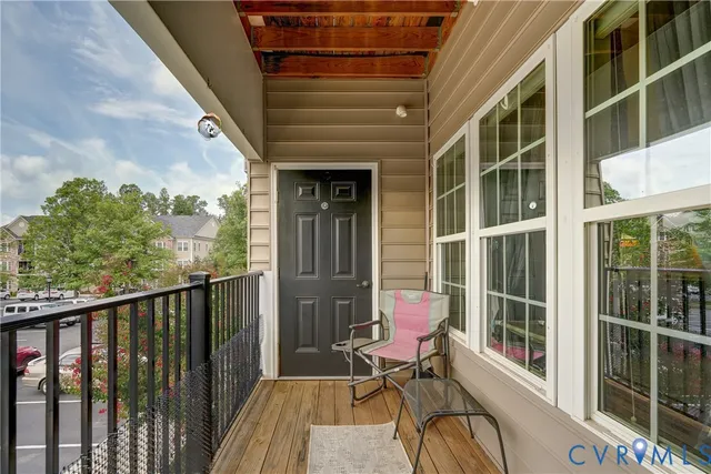a view of a balcony with chairs