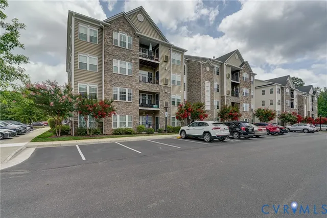 a view of a brick house with potted plants
