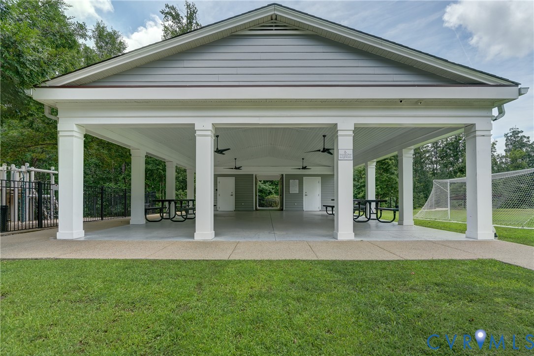 14010 Briars Circle, Unit 204 Midlothian, VA 23114 - Photo 38 of 40 a view of a house with porch and garden