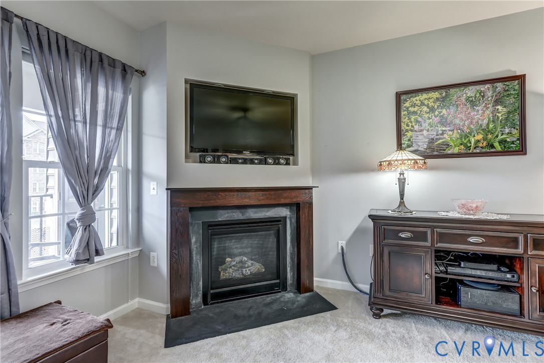 14010 Briars Circle, Unit 204 Midlothian, VA 23114 - Photo 6 of 40 a living room with furniture and a fireplace