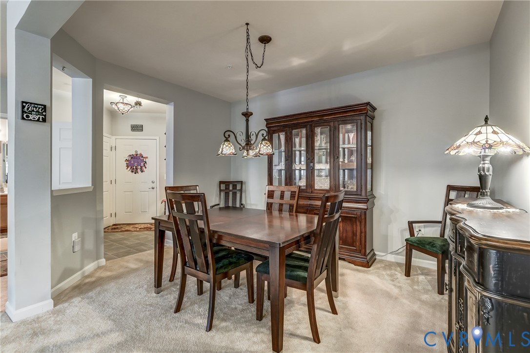 14010 Briars Circle, Unit 204 Midlothian, VA 23114 - Photo 7 of 40 a view of a dining room with furniture window and wooden floor