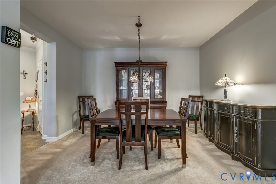 14010 Briars Circle, Unit 204 Midlothian, VA 23114 - Photo 8 of 40 a dining room with furniture window and wooden floor