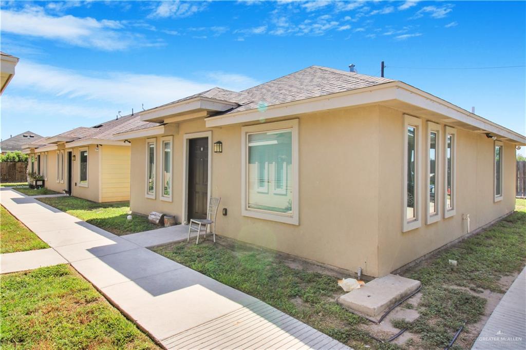 606 North Inspiration Road, Unit 6 Alton, TX 78573 - Photo 1 of 14 a front view of a house with garden