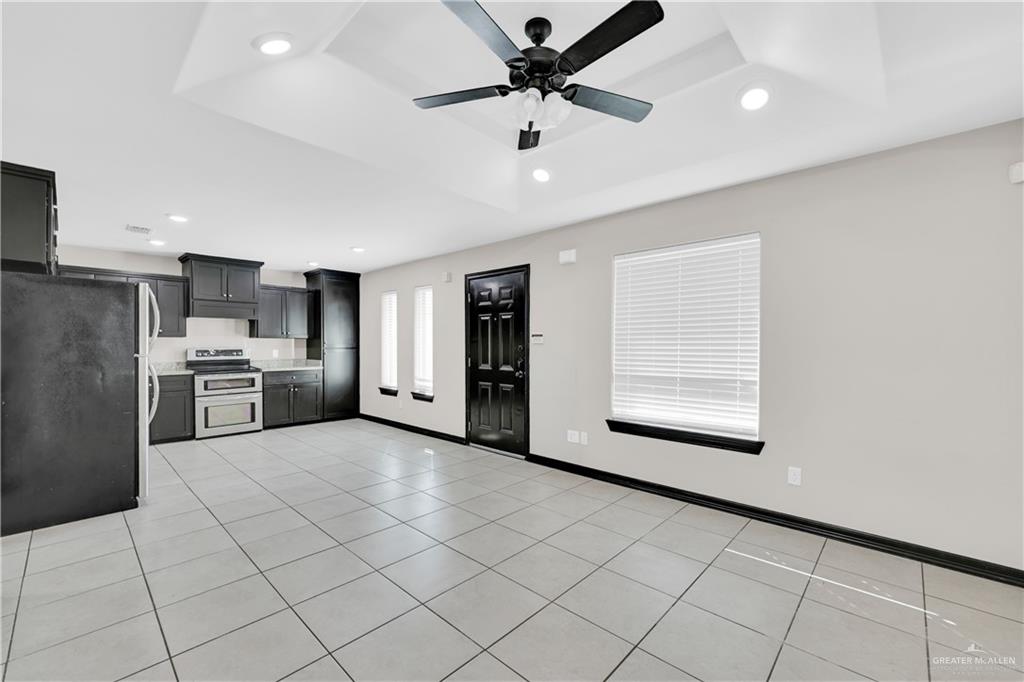 606 North Inspiration Road, Unit 6 Alton, TX 78573 - Photo 3 of 14 a view of a kitchen with furniture and a kitchen