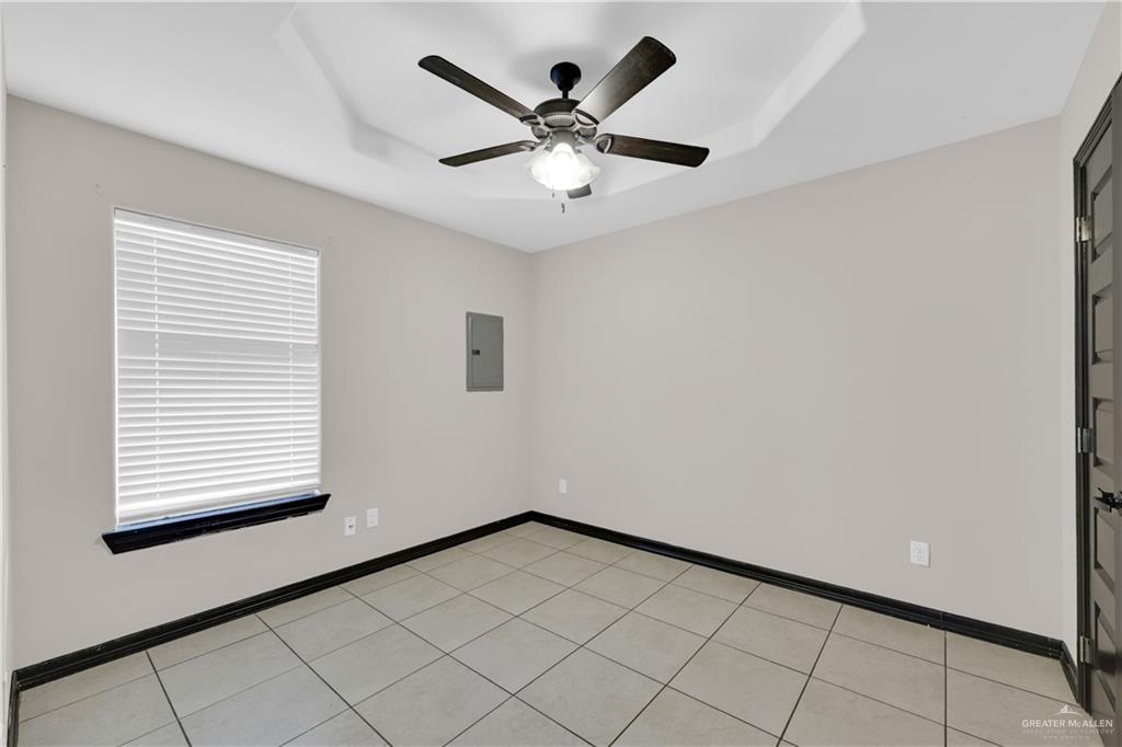 606 North Inspiration Road, Unit 6 Alton, TX 78573 - Photo 9 of 14 a view of an empty room with a window