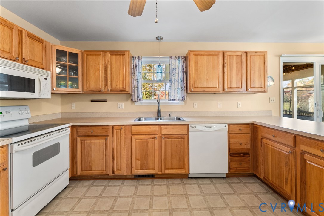 1120 South Glebe Road Montross, VA 22520 - Photo 11 of 29 a kitchen with stainless steel appliances granite countertop a sink and cabinets