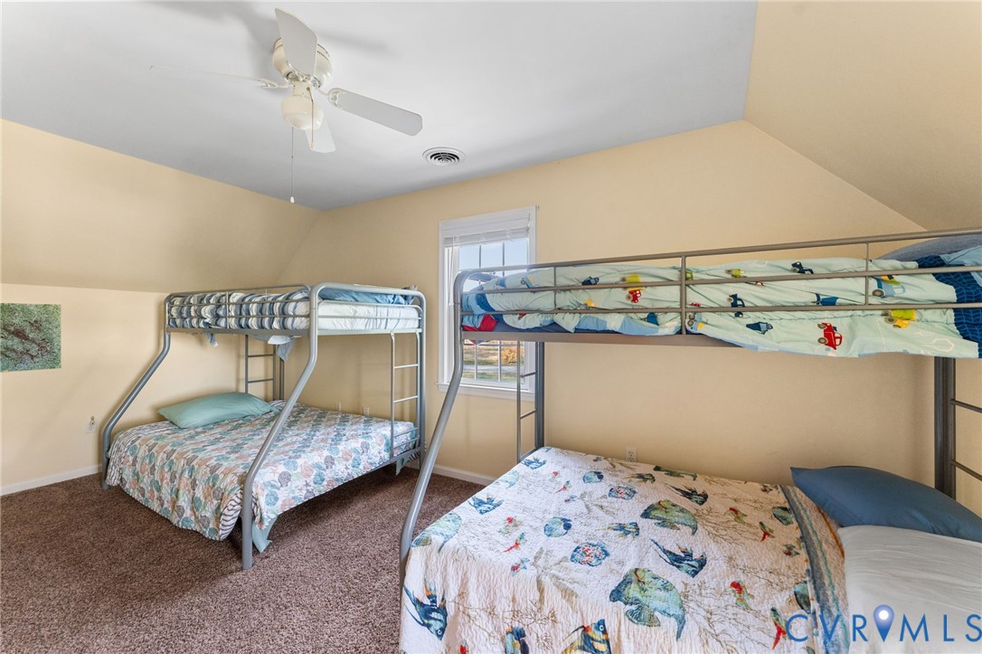 1120 South Glebe Road Montross, VA 22520 - Photo 21 of 29 a bedroom with a bed and a table