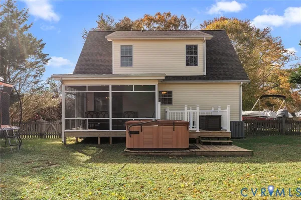 a view of a house with a yard and sitting area