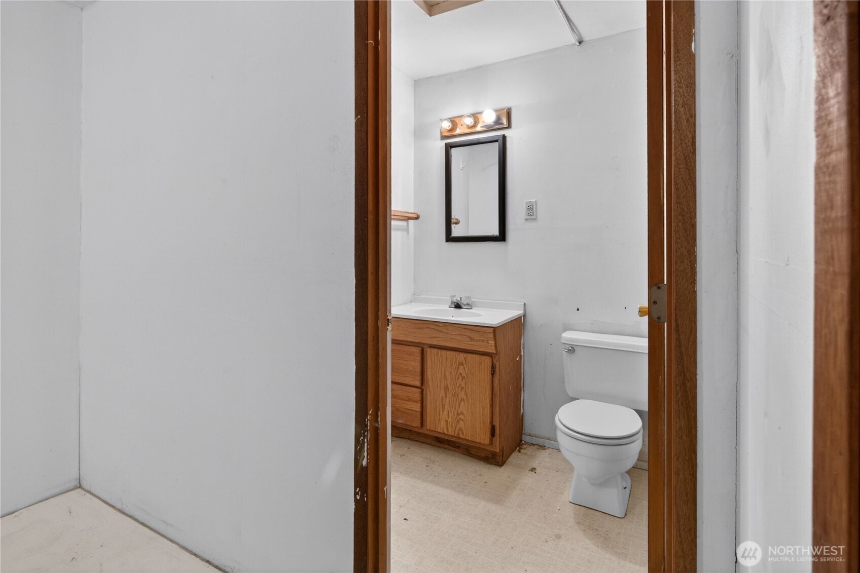 716 Murphy Way Sultan, WA 98294 - Photo 11 of 31 a bathroom with a toilet sink vanity and mirror