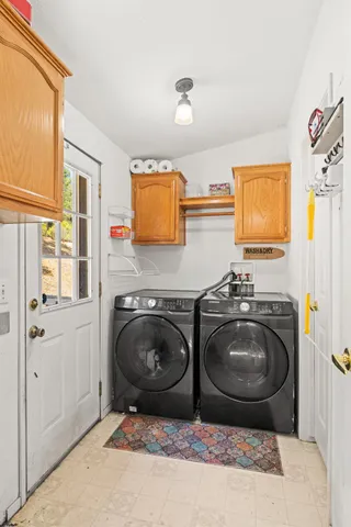 a kitchen with sink washer and dryer