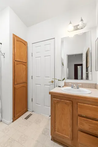 a bathroom with a sink and a mirror