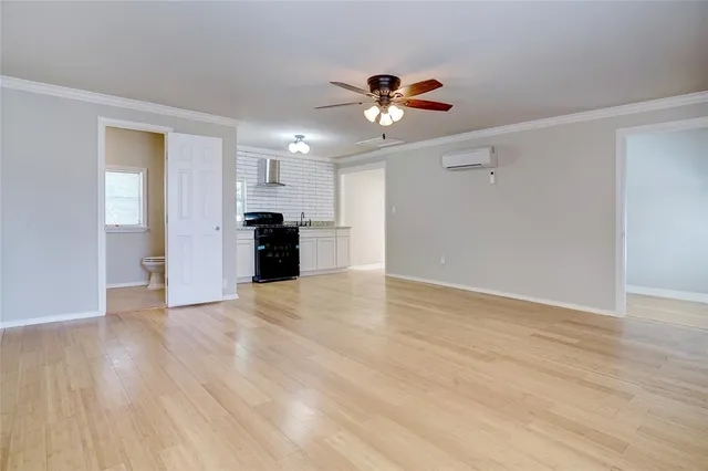 a view of a kitchen with a dishwasher cabinets and wooden floor