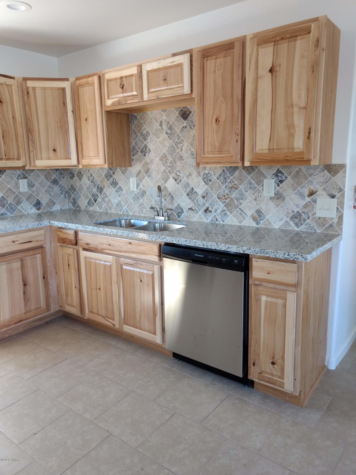 9 County Road Show Low, AZ 85901 - Photo 11 of 46 a view of a kitchen with granite countertop cabinets